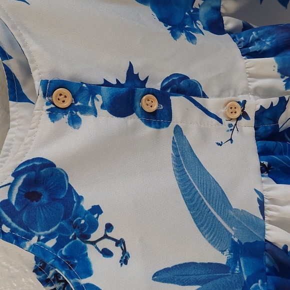 Girls blue and white floral dress with cream buttons and a satin like material. - Picture 3 of 6